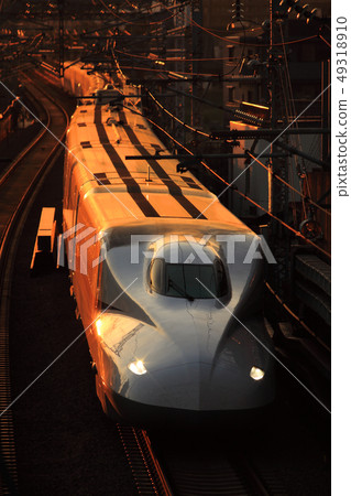 Shinkansen N700 series running at sunset 49318910
