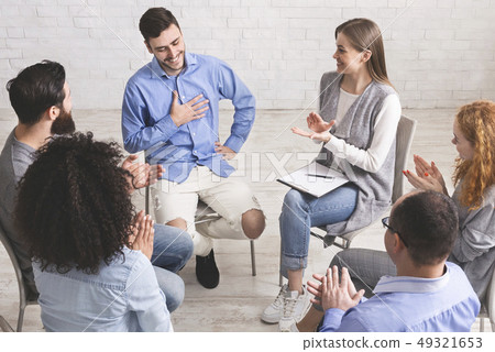 Happy people clapping at support group meeting 49321653