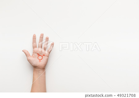Transgender symbol painted on palm, copy space 49321708