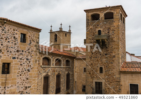 View of the towers and stone buildings of the old town from the Plaza de San Jorge in Caceres. 49321860