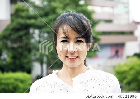 Beautiful woman smile portrait in public park. Beautiful woman smile portrait in public park. 49321996