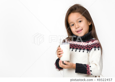 little child girl holding glass of milk on white background little child girl holding glass of milk on white background 49322457