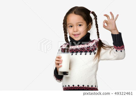 little child girl holding glass of milk on white background little child girl holding glass of milk on white background 49322461