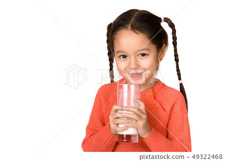 little child girl holding glass of milk on white background little child girl holding glass of milk on white background 49322468