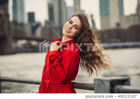 Happy smiling woman with long beautiful hair Happy smiling woman with long beautiful hair 49323187