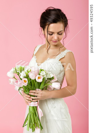 Portrait of beautiful bride with wedding bouquet Portrait of beautiful bride with wedding bouquet 49324595