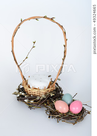 The nest with green, yellow, pink easter eggs The nest with green, yellow, pink easter eggs 49324665