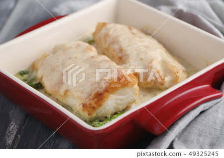 Baked haddock fish with vegetables Baked haddock fish with vegetables 49325245