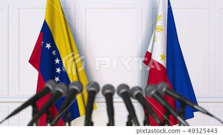 Flags of Venezuela and Philippines at international meeting or negotiations press conference. 3D 49325443