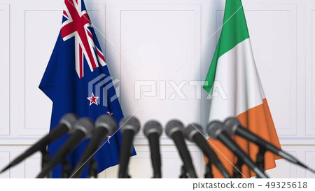 Flags of New Zealand and Ireland at international meeting or negotiations press conference. 3D Flags of New Zealand and Ireland at international meeting or negotiations press conference. 3D 49325618