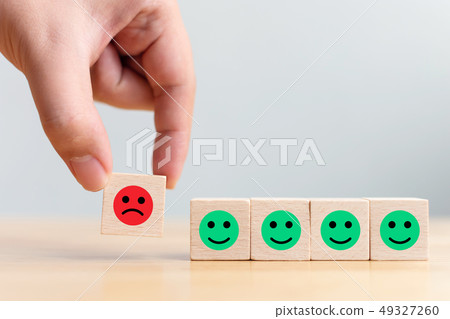 Wooden block with icon face emotion happiness Wooden block with icon face emotion happiness 49327260