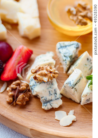 blue cheese, dorblu slices close up. blue cheese, dorblu slices close up. 49328390