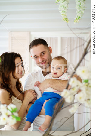 Happy young family enjoy time together Happy young family enjoy time together 49328419