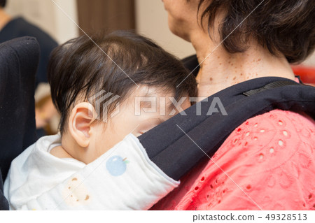 Grandson hugged by grandma 49328513