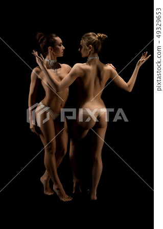 Two beautiful women topless shot Two beautiful women topless shot 49329653