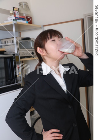 Business woman drinking milk 49330460