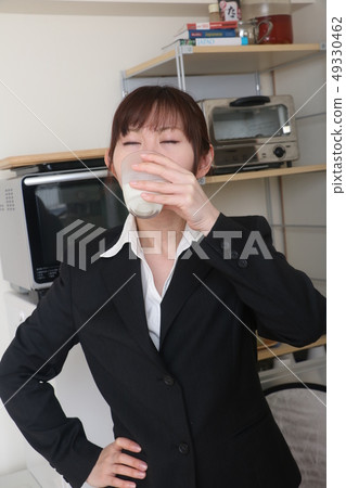 Business woman drinking milk 49330462