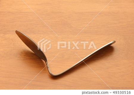 Bent spoon. Magic, psychic image etc. Bent spoon. Magic, psychic image etc. 49330516