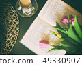 Vintage books with bouquet of flowers nostalgic vintage background 49330907