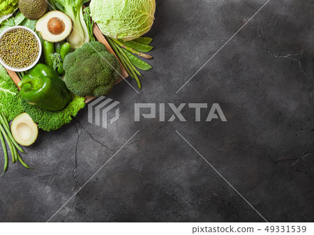 Assorted green toned raw organic vegetables 49331539