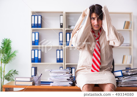 Crazy young man in straitjacket at the office  49334080