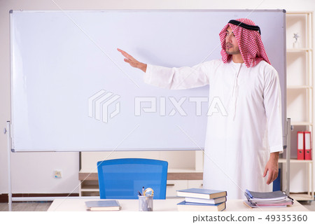 Arab teacher in front of whiteboard Arab teacher in front of whiteboard 49335360
