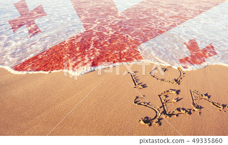Beach sand, sea and flag Georgia. I love Georgia 49335860