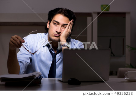 Young handsome employee and too much work in the office  49336238