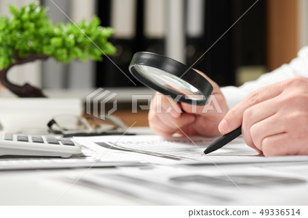 Businessman working in office and calculating Businessman working in office and calculating 49336514