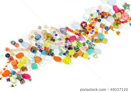 An overhead photo of many different beads, shot from the top on a white background with a place for An overhead photo of many different beads, shot from the top on a white background with a place for 49337120