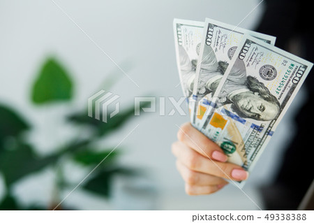 Woman With Money at Workplace. Business Concept 49338388
