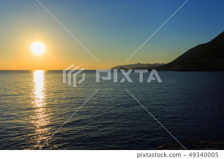 Sunrise over the mountains and the sea Sunrise over the mountains and the sea 49340005