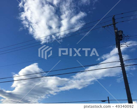 Blue sky and telephone pole 49340092