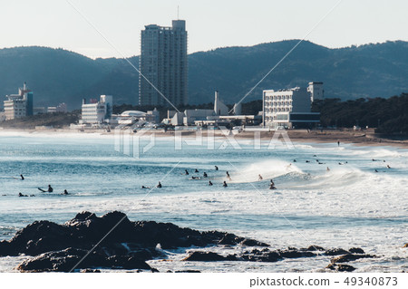 Winter sea and surfers Winter sea and surfers 49340873
