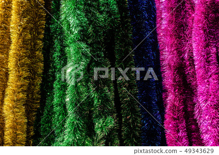 Various colored Christmas decorations in the view Various colored Christmas decorations in the view 49343629