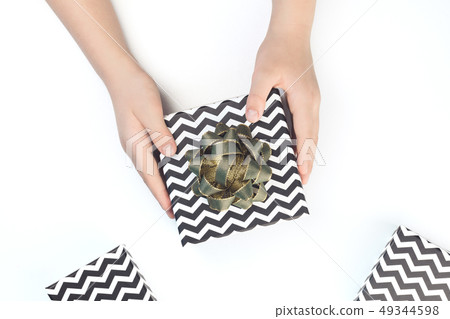 Black and white chevron gift boxes with green bows Black and white chevron gift boxes with green bows 49344598