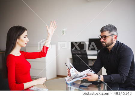 Business Woman Gives Money to Men. Woman Dressed in Red Dress Gives Bribe. Business Man In Gray 49345143