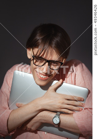 IT computer nerd. Creative teen millenial portrait indoors. Funny young man with happy face 49346426