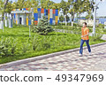 Man running along waterfront 49347969