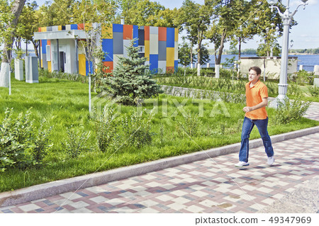 Man running along waterfront Man running along waterfront 49347969