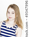 Cute girl with blond long hair on white 49347996