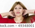 Smiling young girl with straight hair and green eyes 49348001