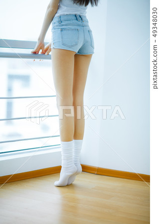 Young girl relaxing at home. Coquette girl resting in living room 49348030