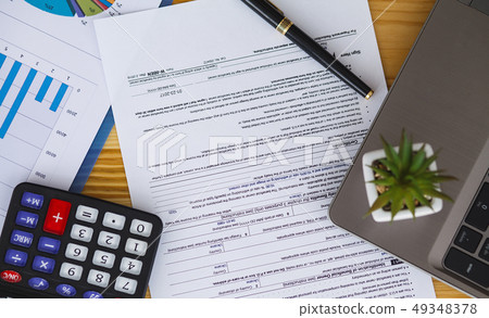 Office desk table with computer, supplies and plant 49348378