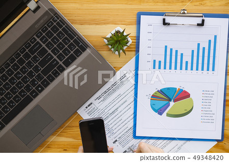 Woman hand writing or signing in a document Woman hand writing or signing in a document 49348420