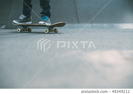 man feet skateboard ramp urban hipster lifestyle 49349212