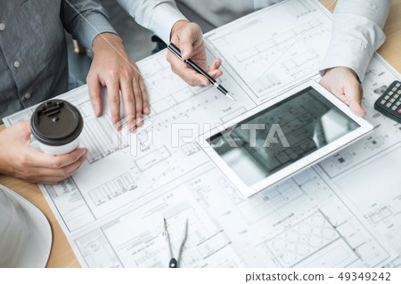 Construction engineering or architect discussing a 49349242