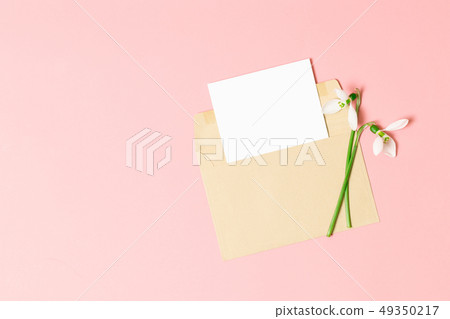 Pink envelope with a spring flower arrangement. Pink envelope with a spring flower arrangement. 49350217