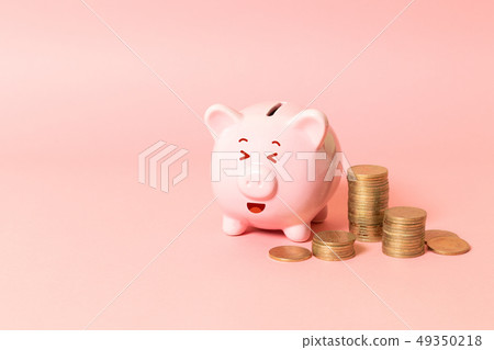 Piggy bank and money tower Piggy bank and money tower 49350218