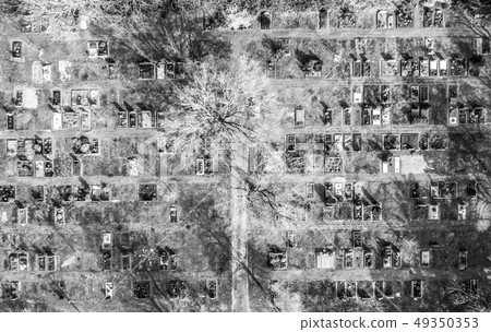 Aerial drone view of a church graveyard cemetary Germany black and white 49350353